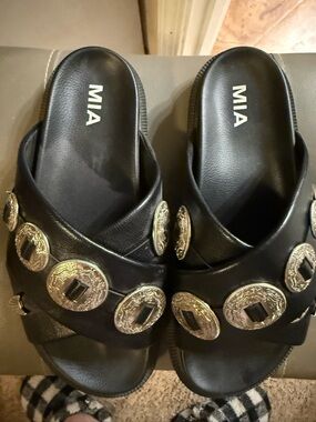 MIA Black Slide Sandals with Gold Medallions
